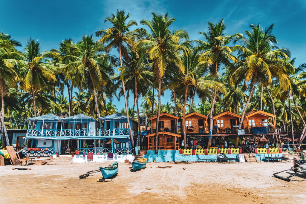 Beach huts with palm trees in Goa